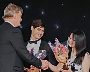 Xiaoyu Weng receives award from Ashboune Principal Mike Kirby