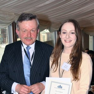 Grace Tucker receives award from Lord Lexden